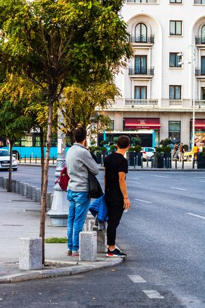 People, tourist crossing the street in downtown Bucharest, Romania, 2019のeditorial素材