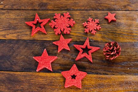 Christmas decorations on wooden board. Colorful, gliterry and shiny Christmas decorations.の写真素材