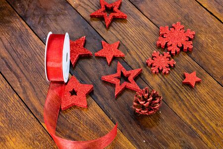 Christmas decorations on wooden board. Colorful, gliterry and shiny Christmas decorations.の写真素材