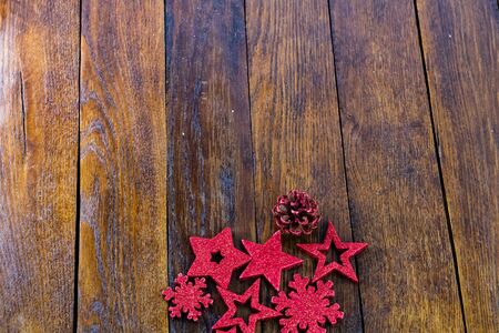 Colorful, glittery and shiny Christmas decorations on wooden board. Christmas concept. Christmas background.の写真素材