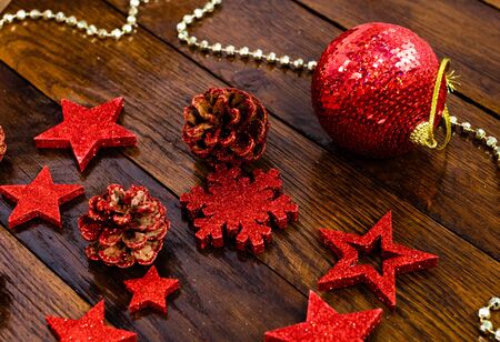 Christmas decorations on wooden board. Colorful, gliterry and shiny Christmas decorations.の写真素材