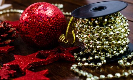 Christmas decorations on wooden board. Colorful, gliterry and shiny Christmas decorations.の写真素材