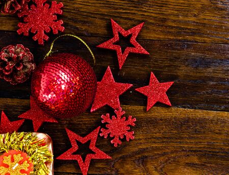 Christmas decorations on wooden board. Colorful, gliterry and shiny Christmas decorations.の写真素材
