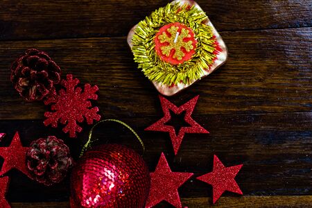 Colorful, glittery and shiny Christmas decorations on wooden board. Christmas concept. Christmas background.の写真素材