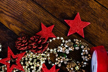 Christmas decorations on wooden board. Colorful, gliterry and shiny Christmas decorations.の写真素材