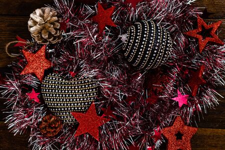 Christmas decorations on wooden board. Colorful, gliterry and shiny Christmas decorations.の写真素材