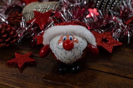 Christmas decorations on wooden board. Christmas concept. Santa Claus Christmas ball.の写真素材