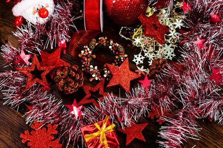 Christmas decorations on wooden board. Colorful, gliterry and shiny Christmas decorations.の写真素材