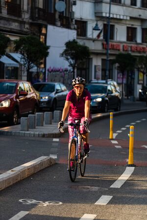 Woman on a bicycle on the streets of Bucharest, Romania, 2019のeditorial素材