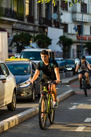 Young man on a bicycle on the streets of Bucharest, Romania, 2019のeditorial素材