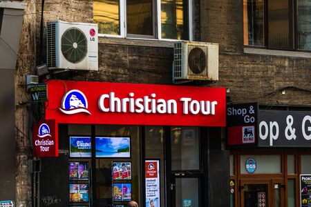 Christian Tour Logo on the wall of the travel agency in Bucharest, Romania, 2019のeditorial素材