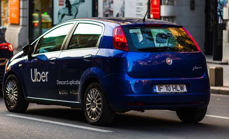 Uber car in traffic, modern city taxi service in Bucharest, Romania, 2019のeditorial素材
