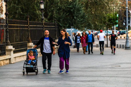 Tourists walking on the sidewalk of Victoriei Way (Calea Victoriei) in Bucharest, Romania, 2019のeditorial素材
