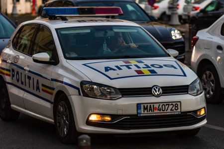 Police car in traffic during rush hour in Bucharest, Romania, 2019