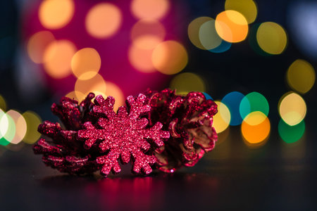 Christmas decoration and ornaments. Christmas composition on blurred lights background. Red and...