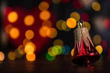 Christmas decoration and ornaments. Christmas composition on blurred lights background. Gliterry Christmas bells.の写真素材