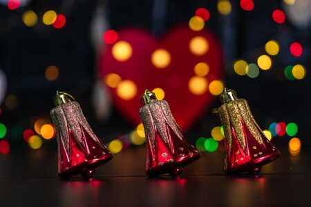 Christmas decoration and ornaments. Christmas composition on blurred lights background. Gliterry Christmas bells.の写真素材