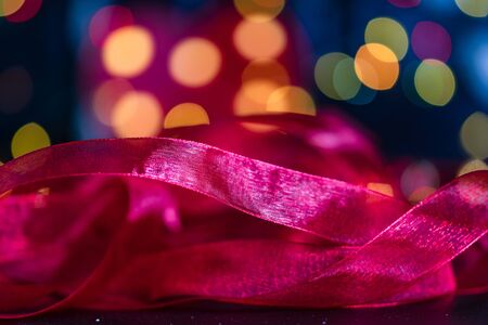 Christmas decoration and ornaments. Christmas composition on blurred lights background. Colorful Christmas garland.の写真素材