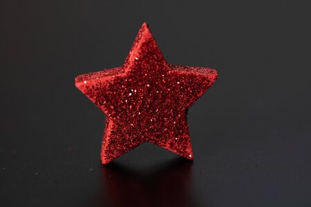 Christmas decoration and ornaments.  Christmas background.  Christmas balls. Red and glittery Christmas star.の写真素材