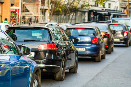 Traffic on the main boulevard in downtown Bucharest. Junction with stopped cars waiting for green light in Bucharest, Romania, 2019のeditorial素材