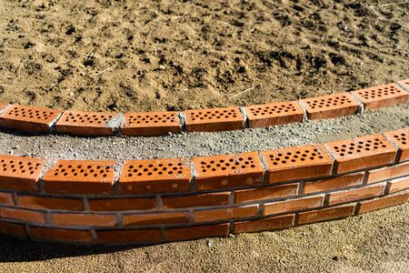 Photo of installed bricks on construction siteの写真素材
