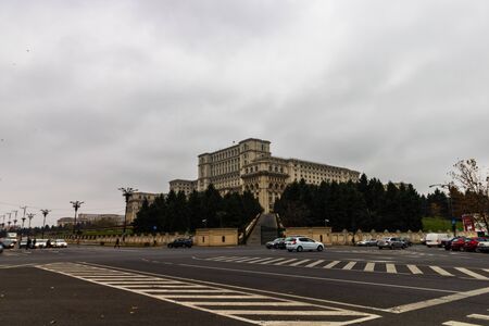 Traffic on the main boulevard in downtown Bucharest. Parliament Palace early in the morning in Bucharest, Romania, 2019のeditorial素材