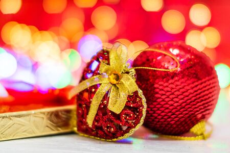 Christmas decorations and ornaments. Christmas composition on blurred lights backgroundの写真素材