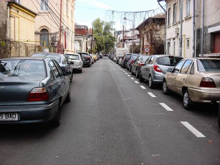 Cars parked along the street. Bucharest, Romania, 2019.のeditorial素材