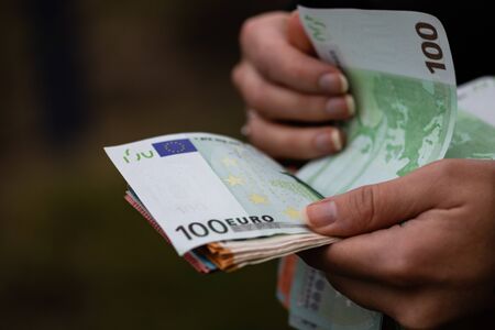 Woman counting money, counting EURO close upの写真素材