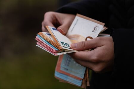 Woman counting money, counting EURO close upの写真素材