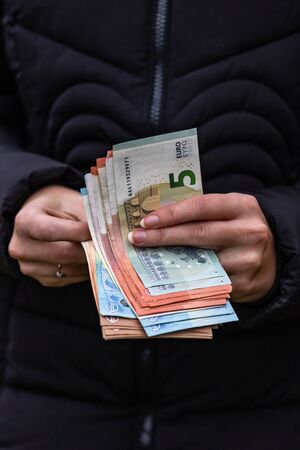 Woman counting money, counting EURO close upの写真素材