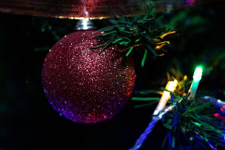 Christmas hanging decorations on fir tree. Decorated Christmas tree.  Fir branches with Christmas decorations.の写真素材