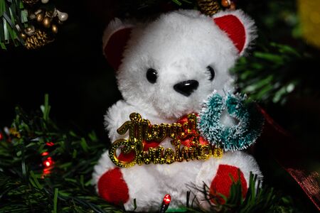 Christmas hanging decorations on fir tree. Decorated Christmas tree.  Fir branches with Christmas decorations. Christmas bear,の写真素材