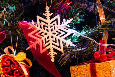 Christmas hanging decorations on fir tree. Decorated Christmas tree. Fir branches with Christmas decorations and garland.の写真素材