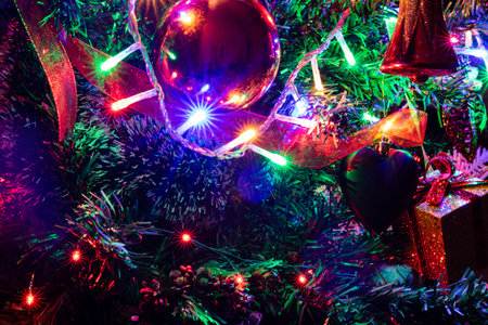Christmas hanging decorations on fir tree. Decorated Christmas tree. Fir branch with Christmas...
