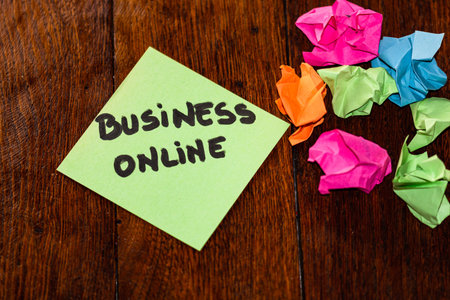 Writing on colorful sticky note Business online and crumpled colorful paper. Text with Business...