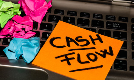 Writing on colorful sticky note Cash flow. Text with cash flow on paper