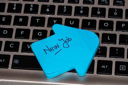 Writing on colorful sticky note New Job.の写真素材