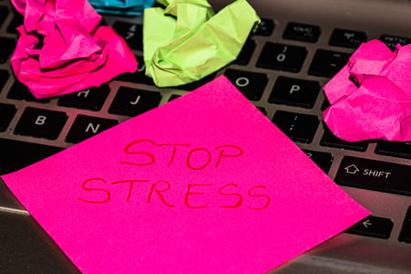 Writing on colorful sticky note Stop stress. Text with Stop stress on paper.