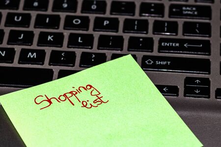 Writing on colorful sticky note Shopping list. Text with Shopping list on paper.の写真素材