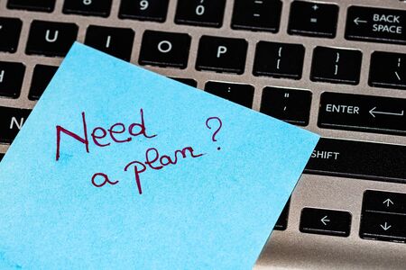 Writing on colorful sticky note Need a plan Text with Need a plan on paper.の写真素材