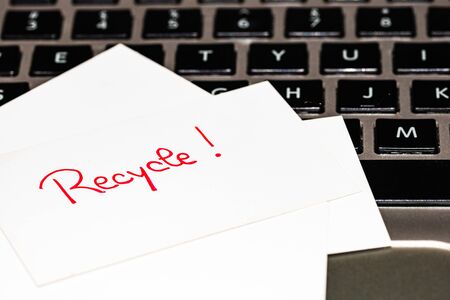 Writing on white label Recycle. Text with Recycle on paper. Label on keyboard.の写真素材