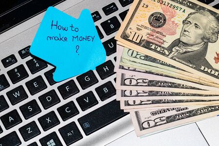 Writing on colorful sticky note How to make moneyの写真素材