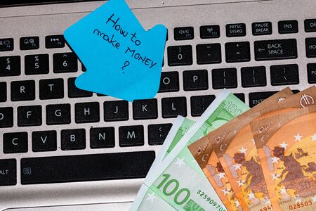 Writing on colorful sticky note How to make moneyの写真素材