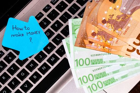 Writing on colorful sticky note How to make moneyの写真素材