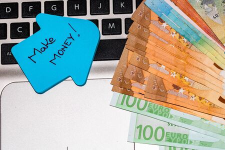 Writing on colorful sticky note make money.の写真素材