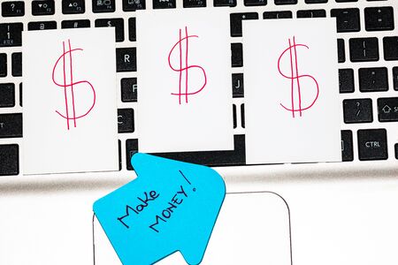 Writing on colorful sticky note make money.の写真素材