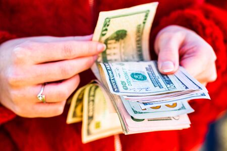 Woman counting money, counting dollars close upの写真素材