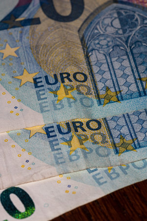 Detail on 20 euro banknote. Close up of banknote laid out on table.