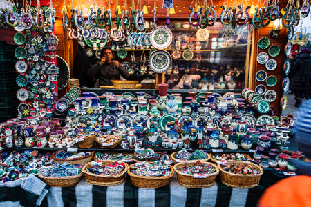Bucharest Christmas market in front of the Palace of Parliament, lights, decorations, hot wine, hot chocolate, presents and people wandering at the Christmas market in Bucharest, Romania, 2019のeditorial素材